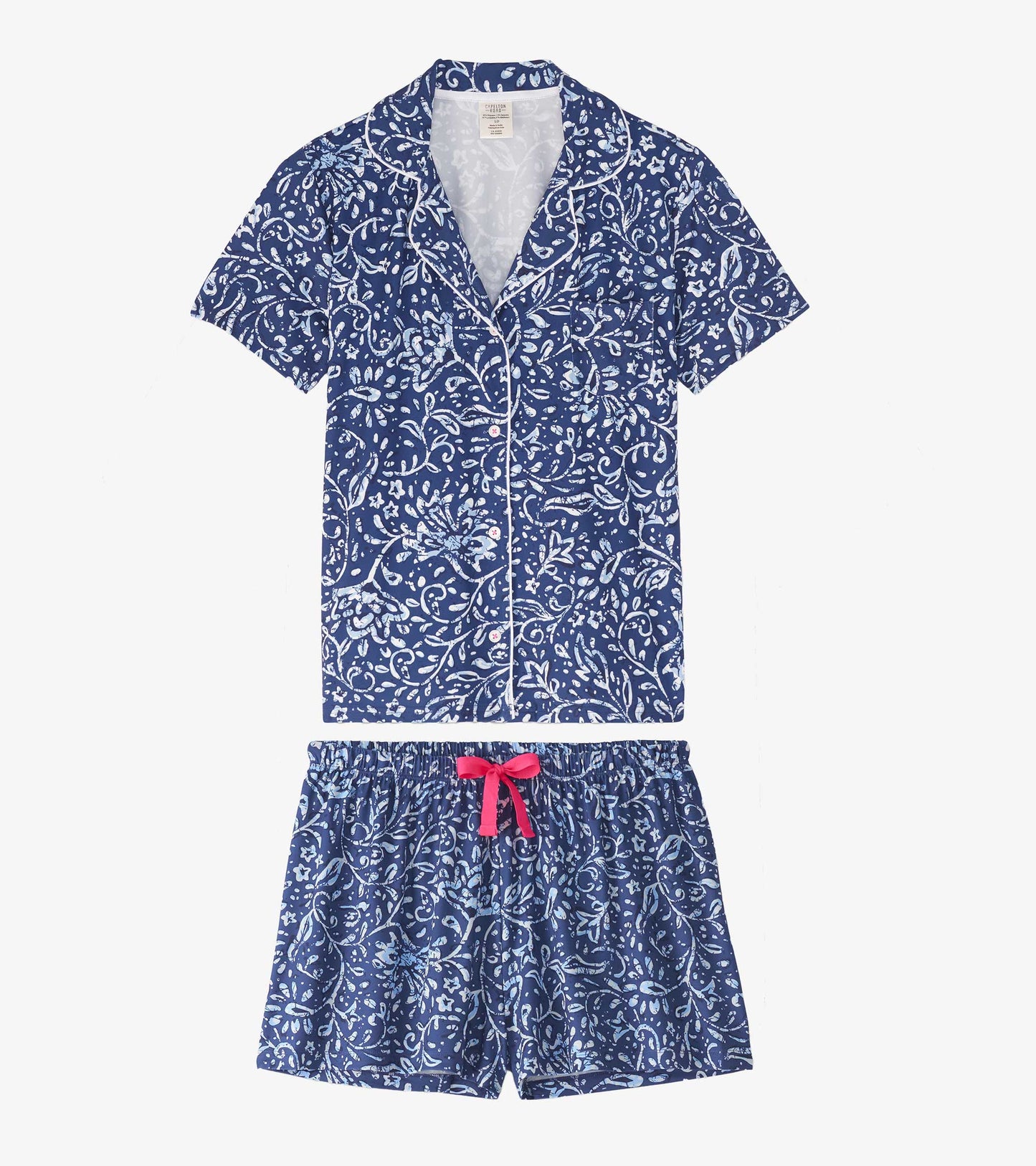 Navy blue short pajama set featuring a floral batik pattern with a button-up top and elastic waistband shorts.