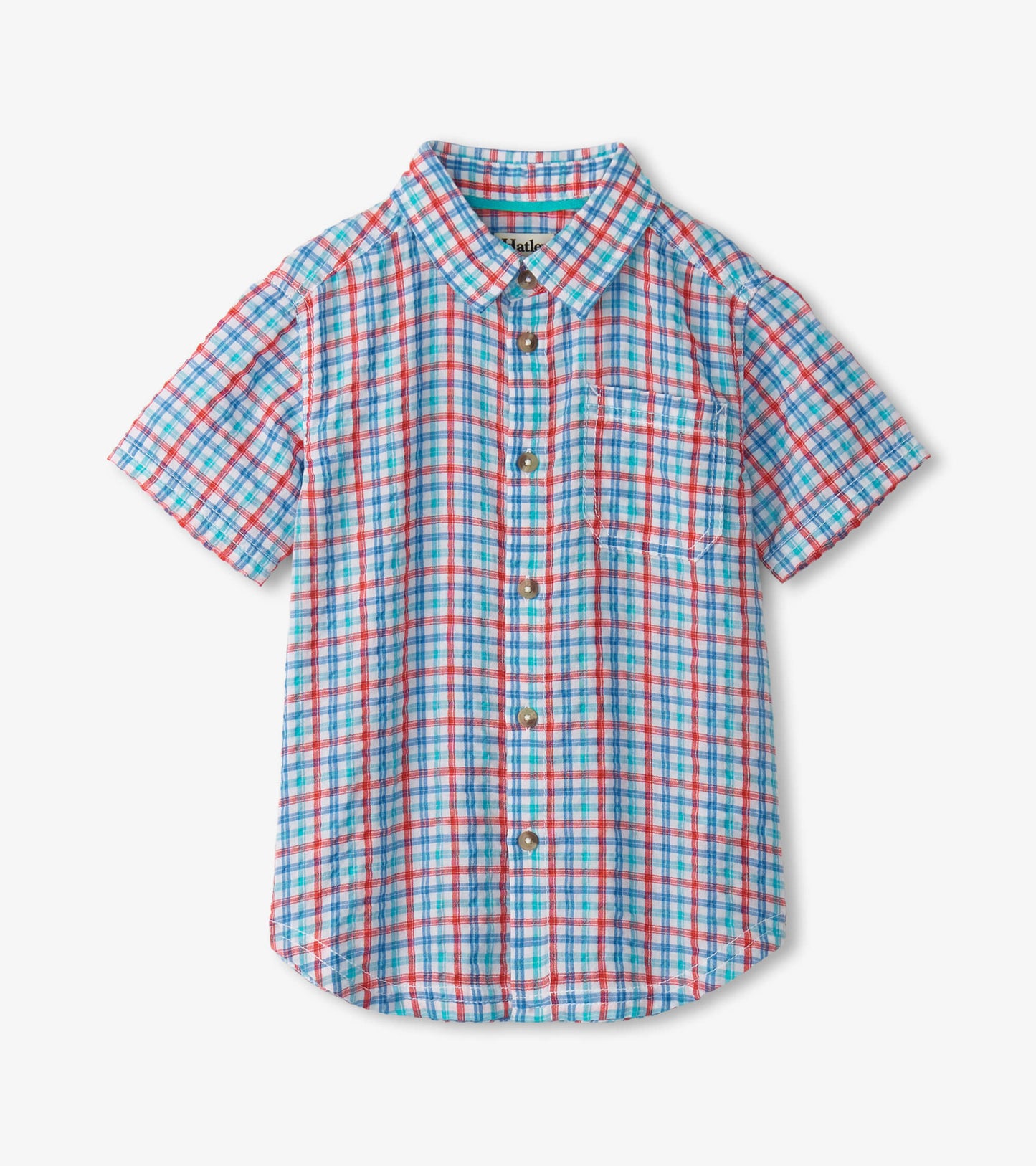 Short-sleeve button-down shirt in blue, red, and white plaid pattern with a chest pocket.