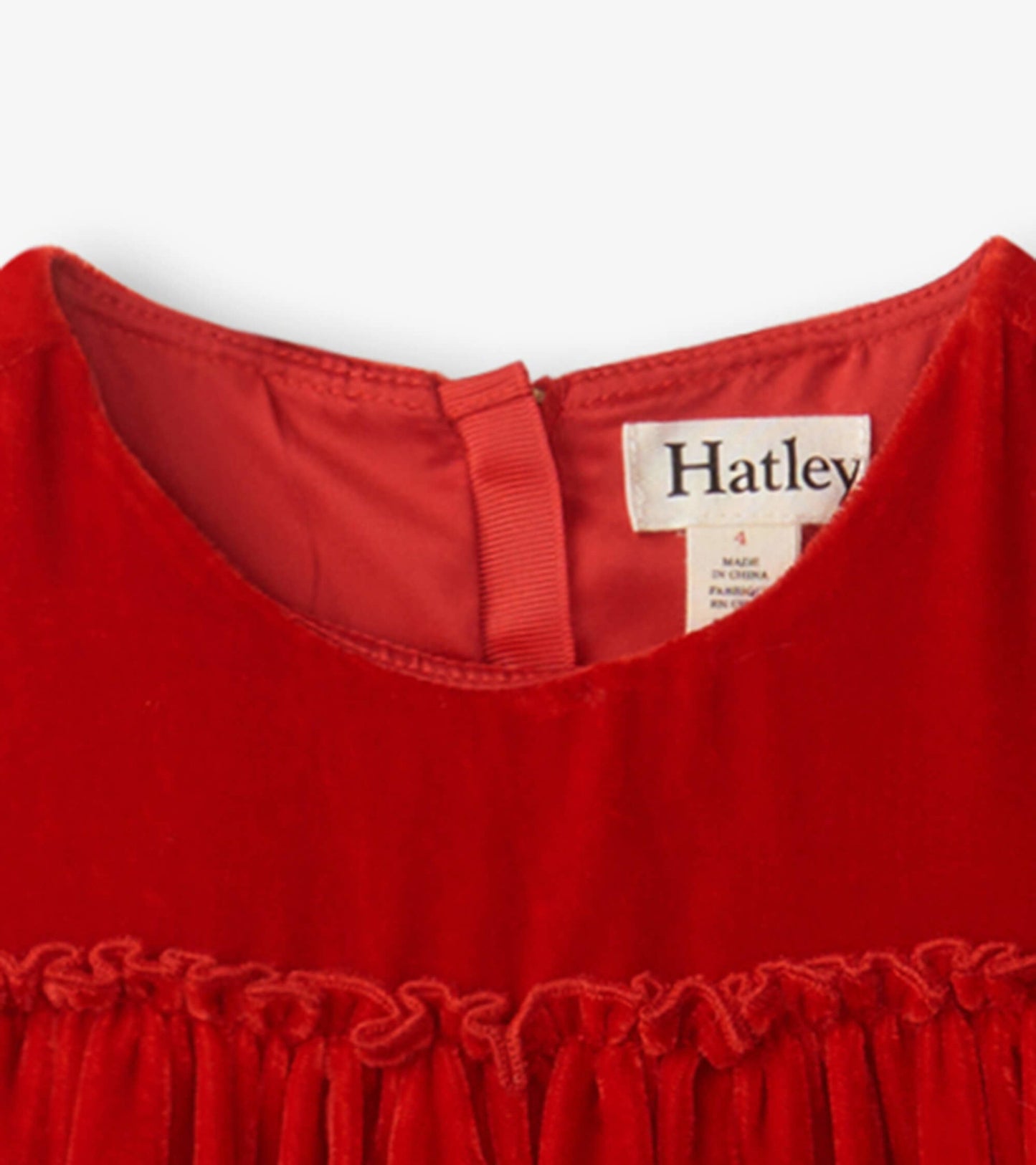 Red velvet dress featuring a smocked panel and a round neckline. Ideal for special occasions or casual wear.