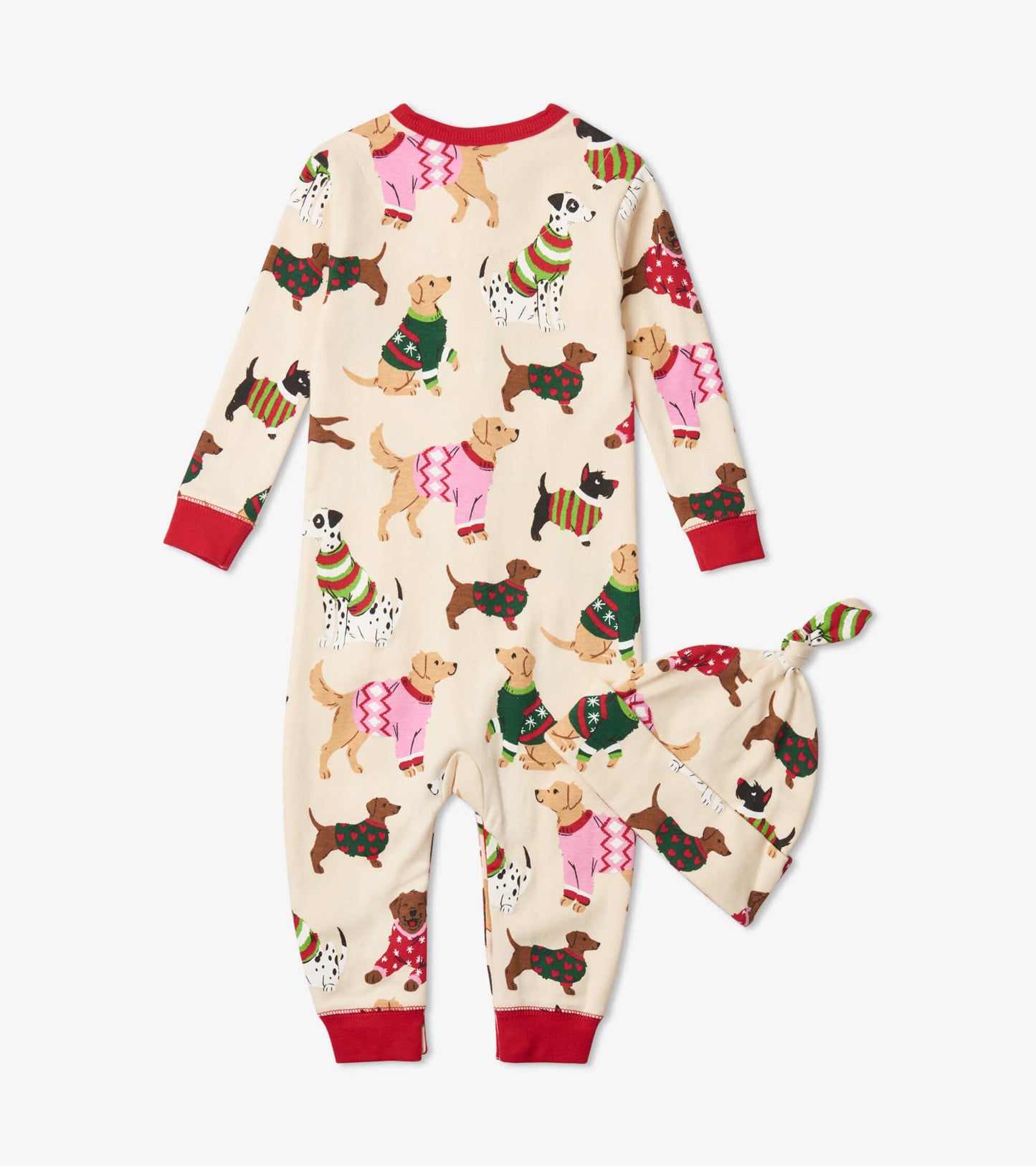 Cream-colored sleeper with festive dog patterns, red cuffs, and matching hat with a knot top. Suitable for infants.