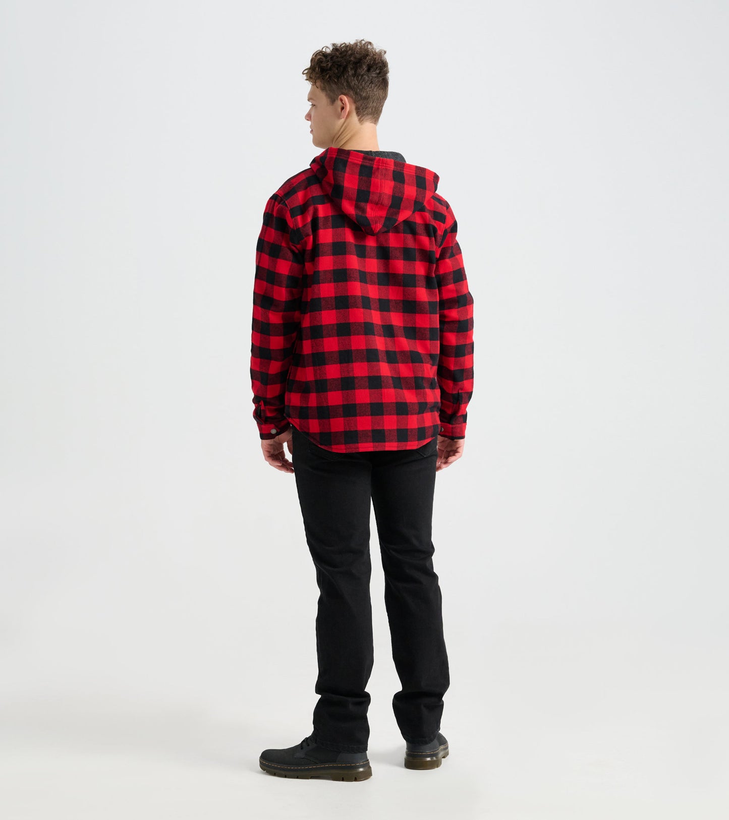 Red and black buffalo plaid flannel jacket with a hood, shown from the back, paired with black pants.