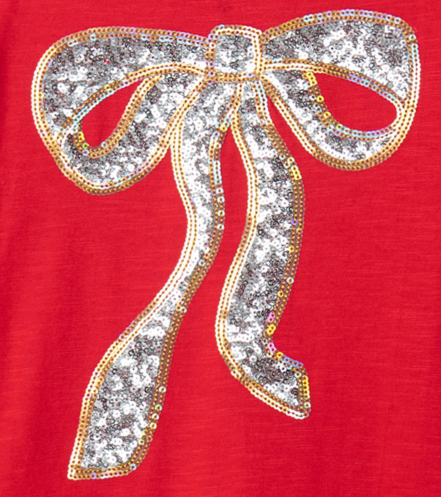 Red dress featuring a large, sparkling silver bow design, perfect for holiday parties.