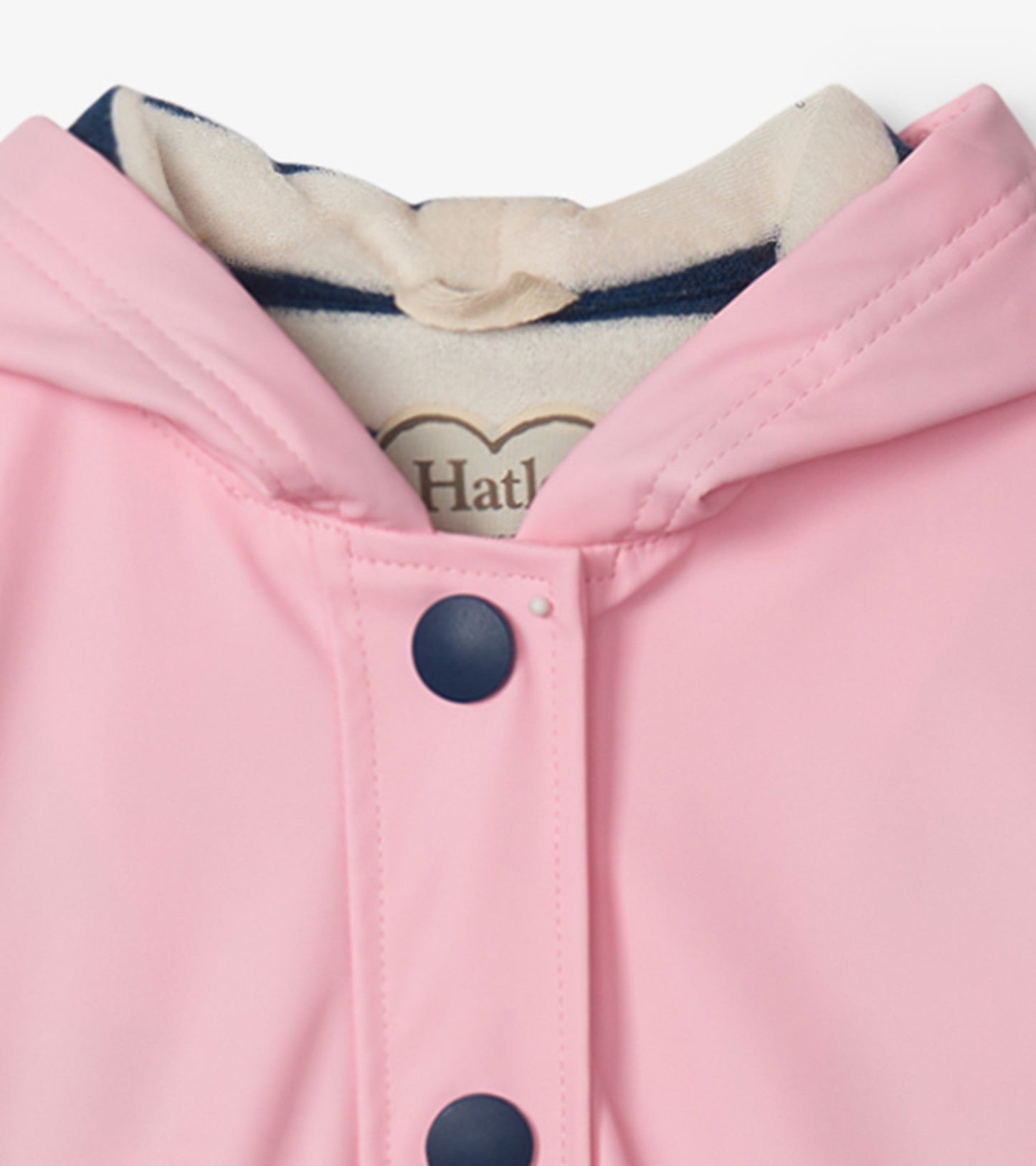 Pink button-up rain jacket with a navy hood lining and navy buttons, designed for girls.