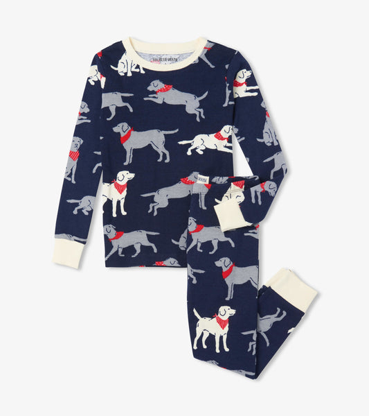 Navy pajama set featuring playful dog patterns with red bandanas, includes long-sleeve top and matching pants.