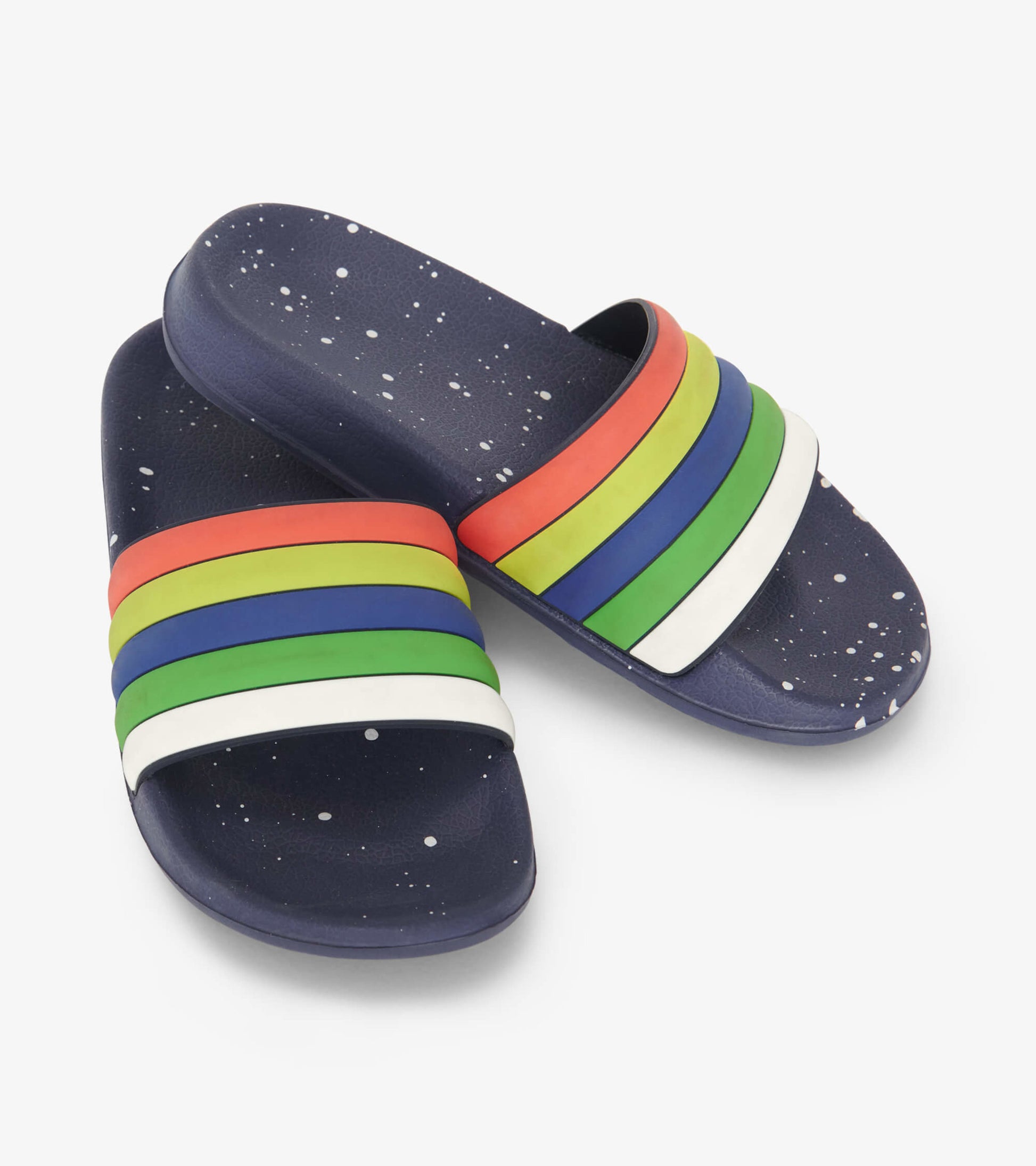Navy slides featuring colorful stripes in red, green, blue, and white, with a speckled pattern on the sole.