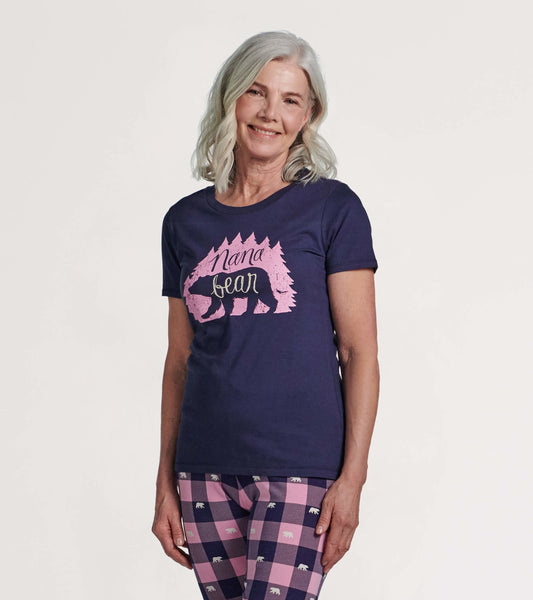 Navy blue short-sleeve pajama t-shirt featuring a pink bear graphic and text, worn by a smiling woman.