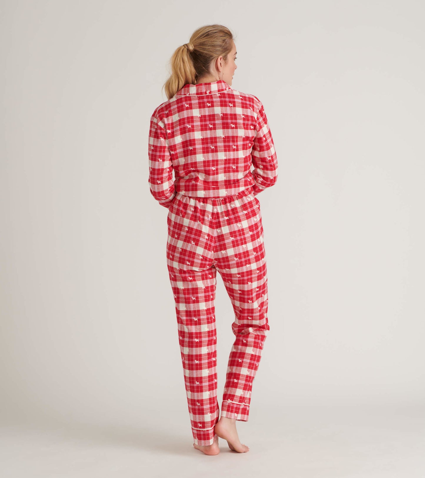 Red and white plaid flannel pajama set with long sleeves and pants, shown from the back.