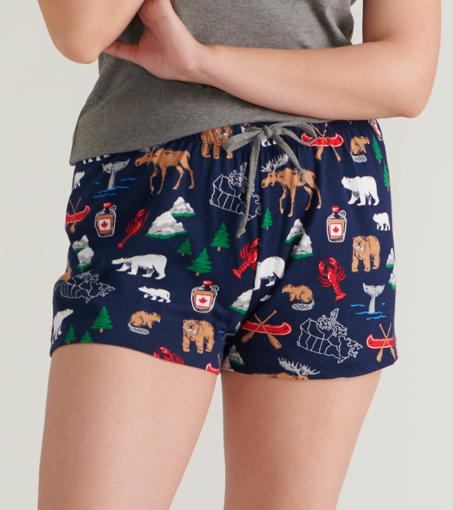 Navy cotton sleep shorts featuring a colorful wildlife and nature print, with an elastic waistband and drawstring.