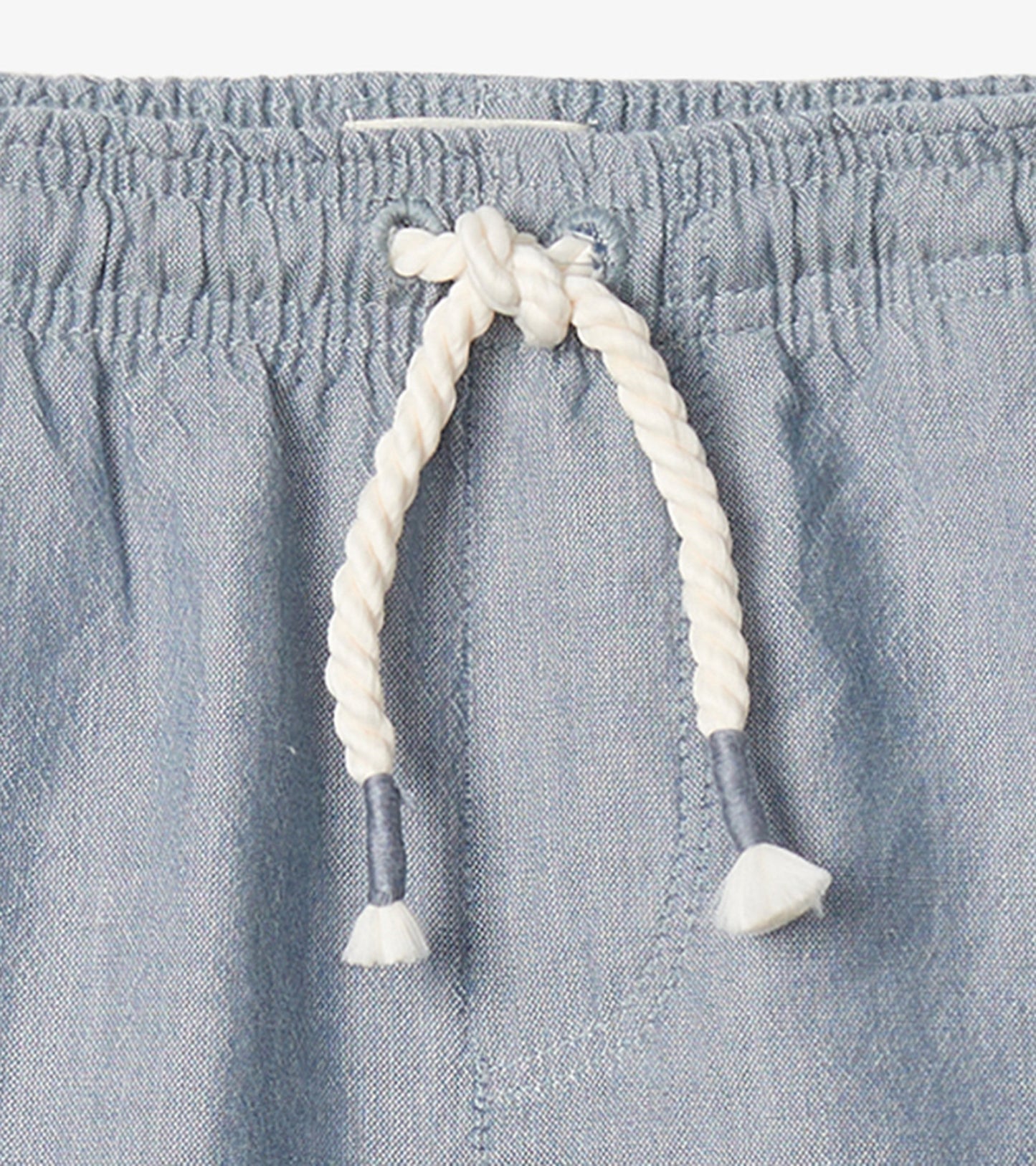 Light blue chambray pull-on shorts with an elastic waistband and a decorative drawstring.