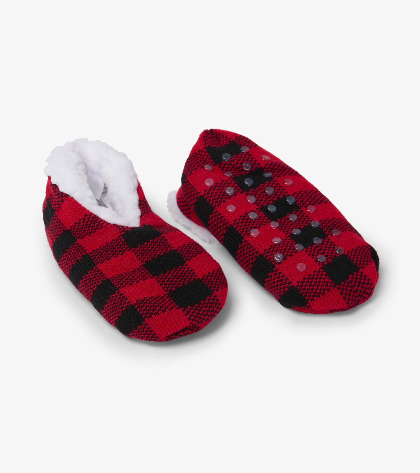 Red and black buffalo plaid kids' slippers with soft white lining and non-slip soles for warmth and comfort.