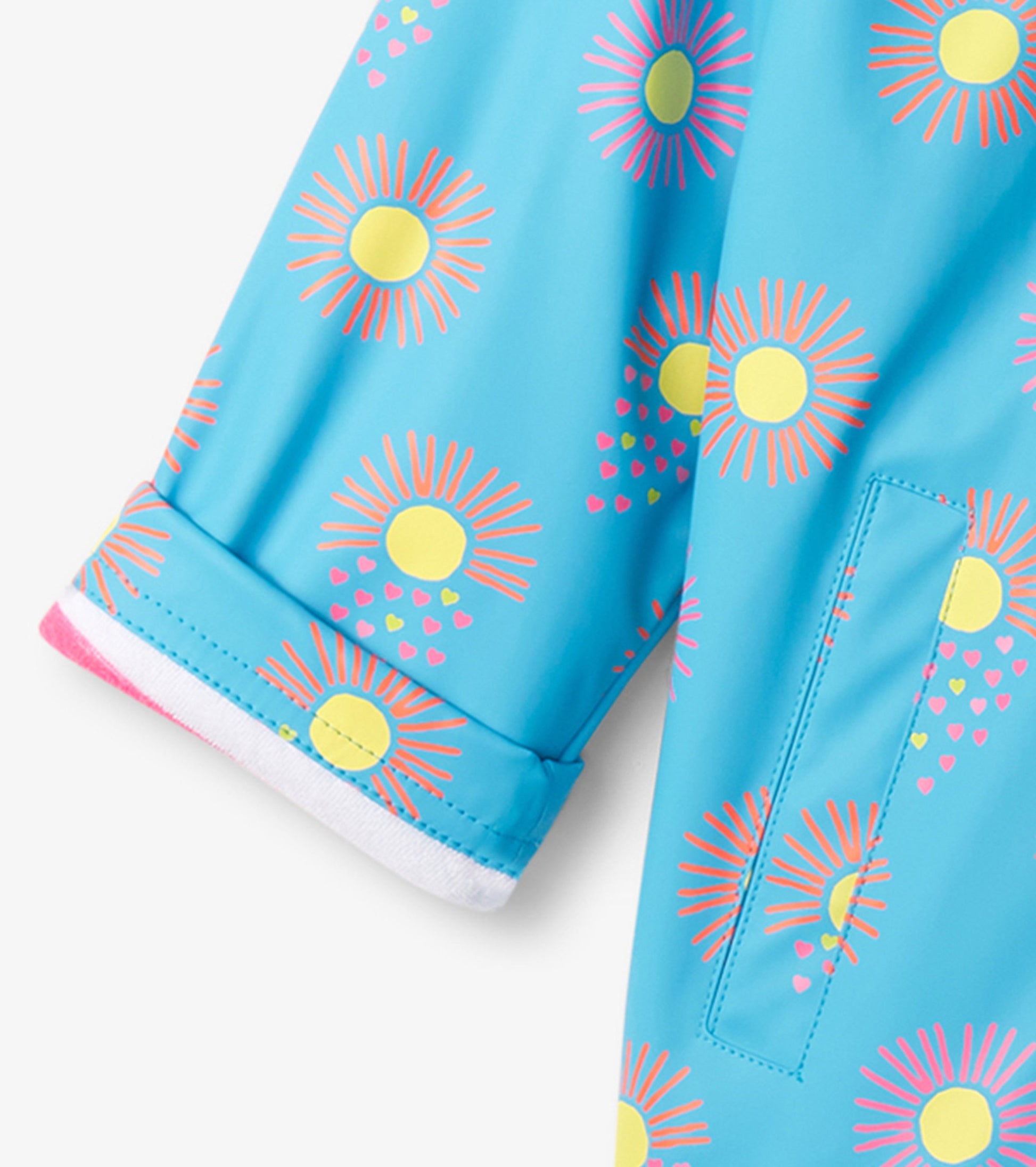 Blue zip-up rain jacket featuring sun and heart patterns, with a cuffed sleeve design.