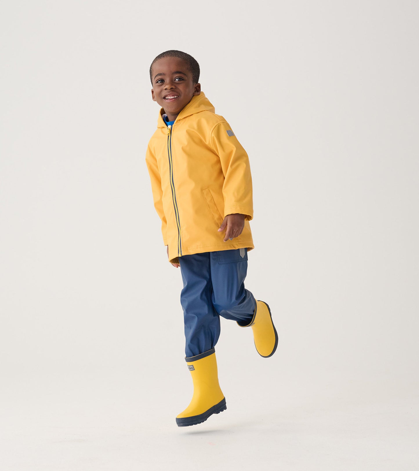 Navy waterproof rain pants for kids, featuring a comfortable fit and durable material, perfect for wet weather play.