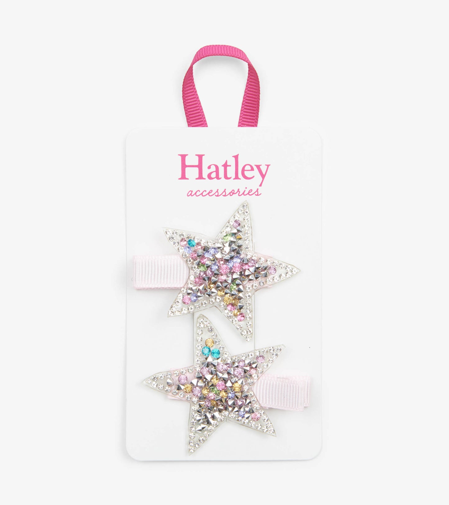 Two star-shaped hair clips with colorful rhinestones and pink elastic bands on a display card.
