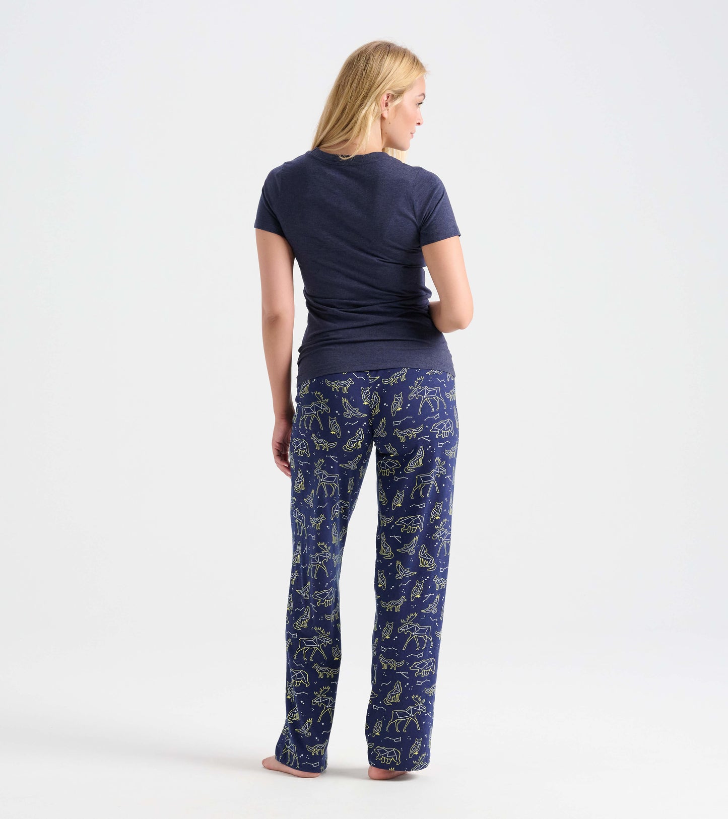 Navy cotton pajama pants featuring animal constellations in a light green pattern, shown from the back.