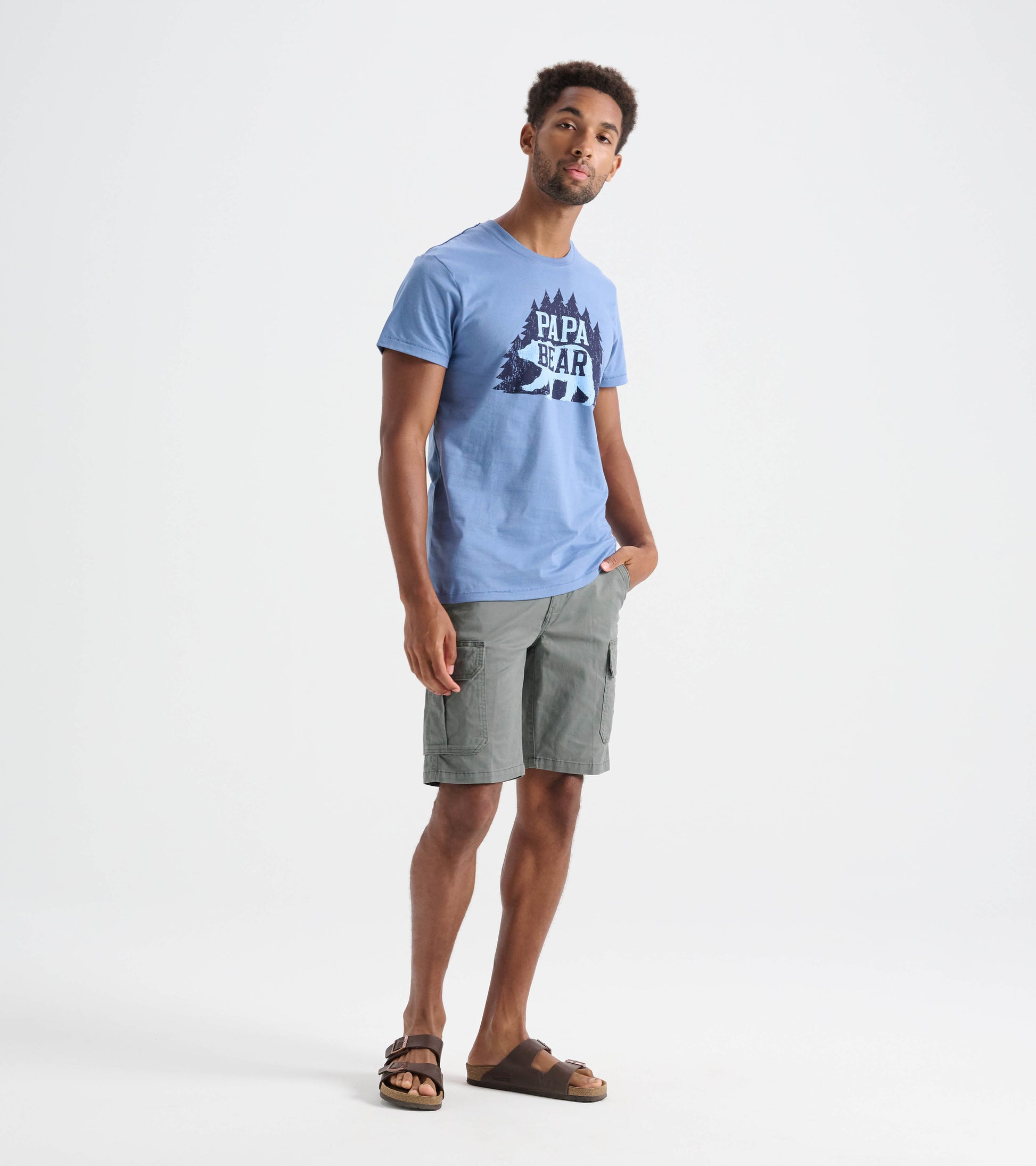 Light blue short-sleeve tee featuring a "Papa Bear" graphic with trees, worn with gray cargo shorts.