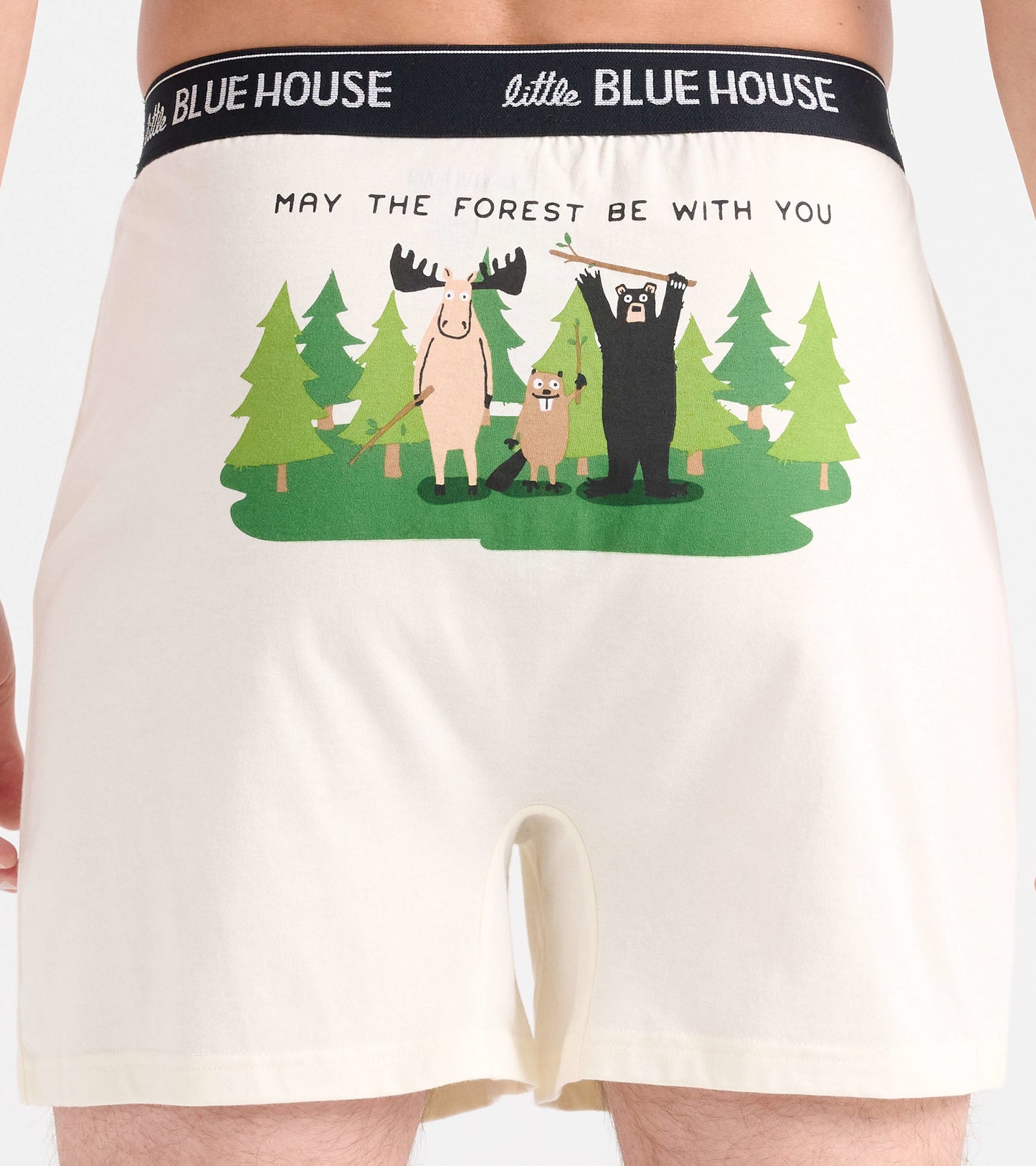 Cream-colored boxer shorts featuring a playful forest animal graphic and the text "MAY THE FOREST BE WITH YOU.