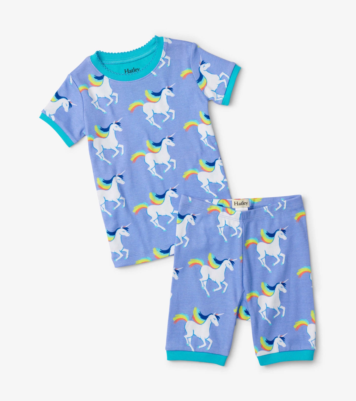 Short pajama set featuring a light blue fabric with a unicorn and rainbow pattern, includes a t-shirt and shorts.