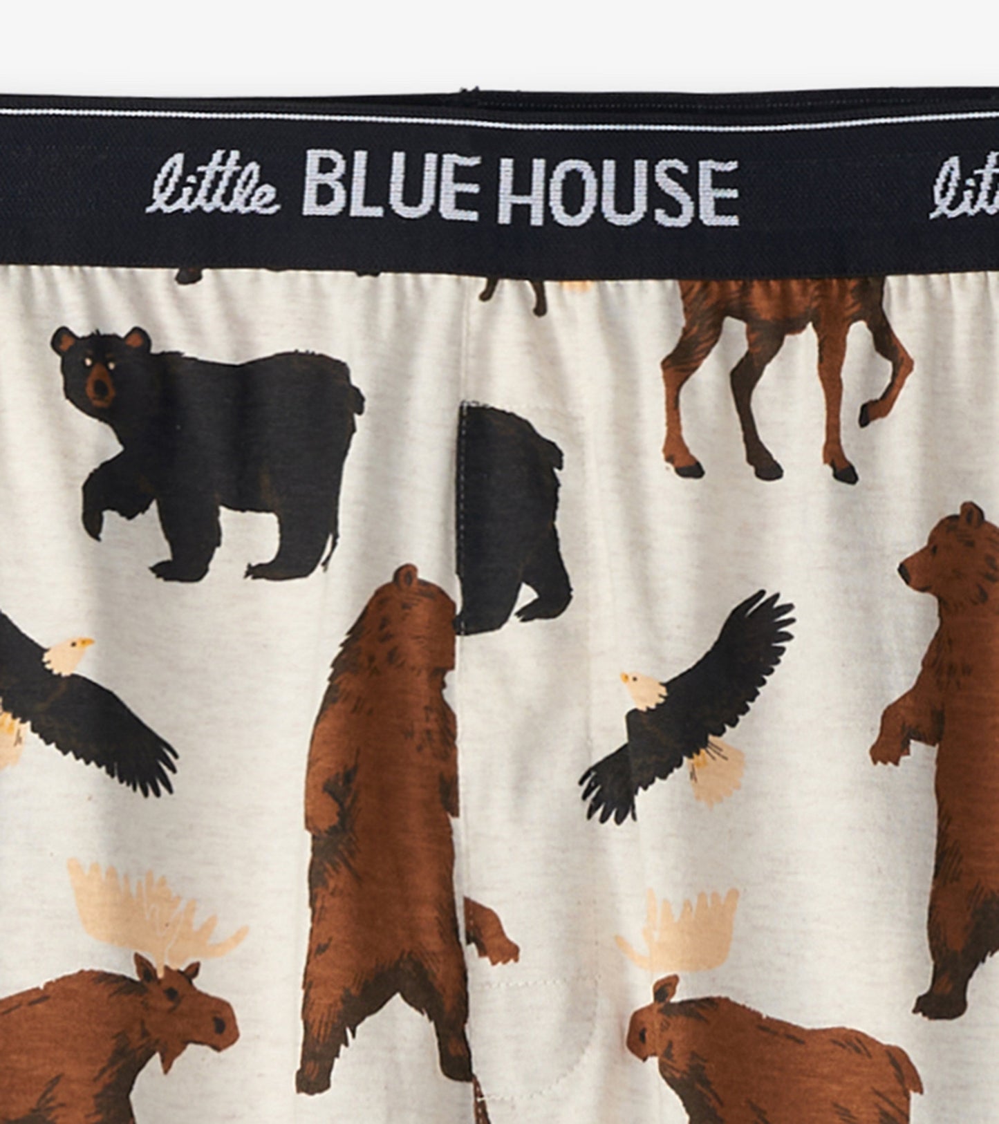 Cotton blend pajama pants featuring a wildlife pattern with bears, moose, and eagles on a light background.