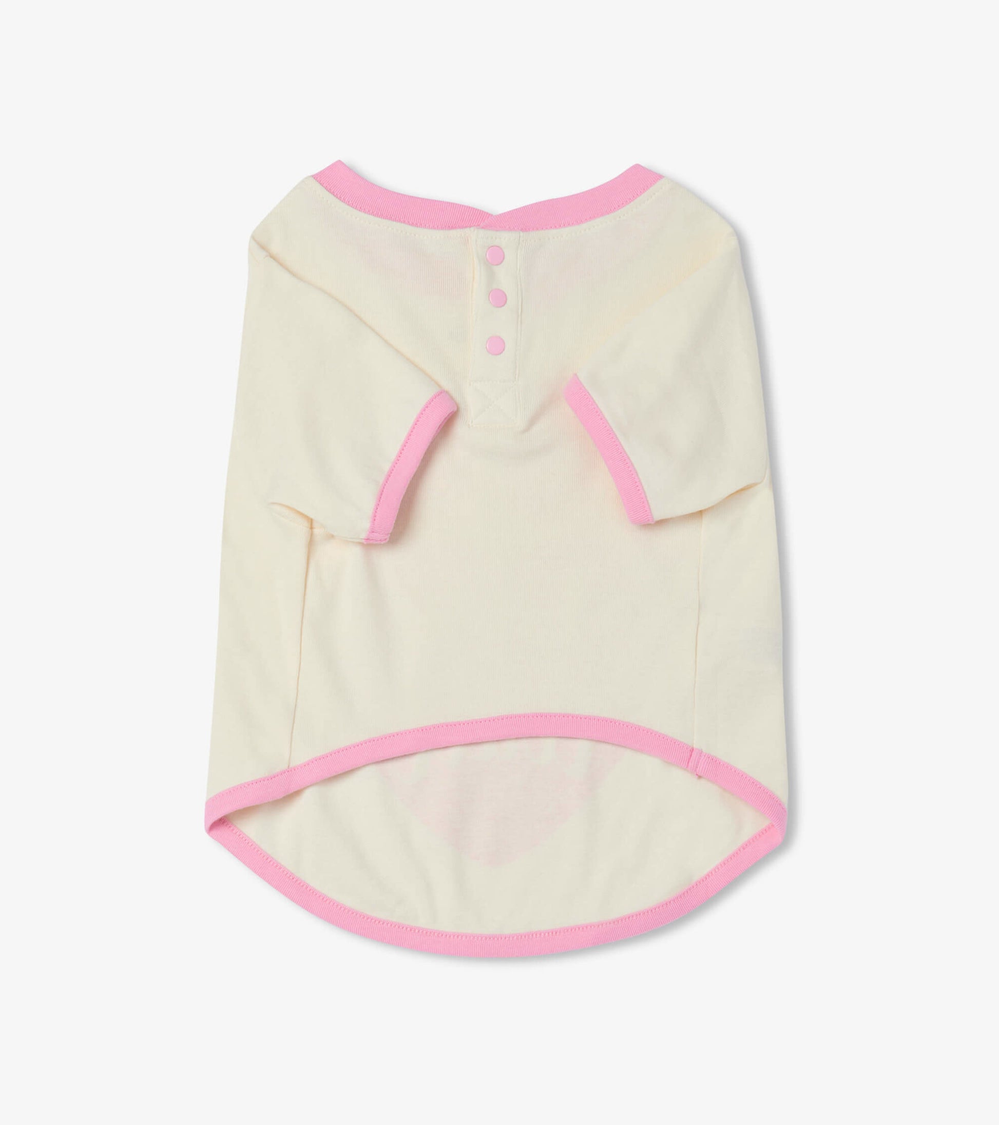 Cream dog tee with pink trim and button detail, featuring a rounded hem and short sleeves.