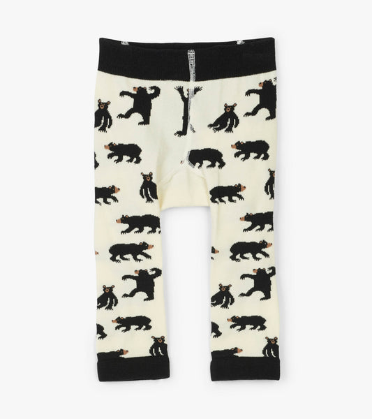 Cream baby tights featuring a playful bear pattern, with a black waistband and cuffs. Suitable for infants 0-24 months.
