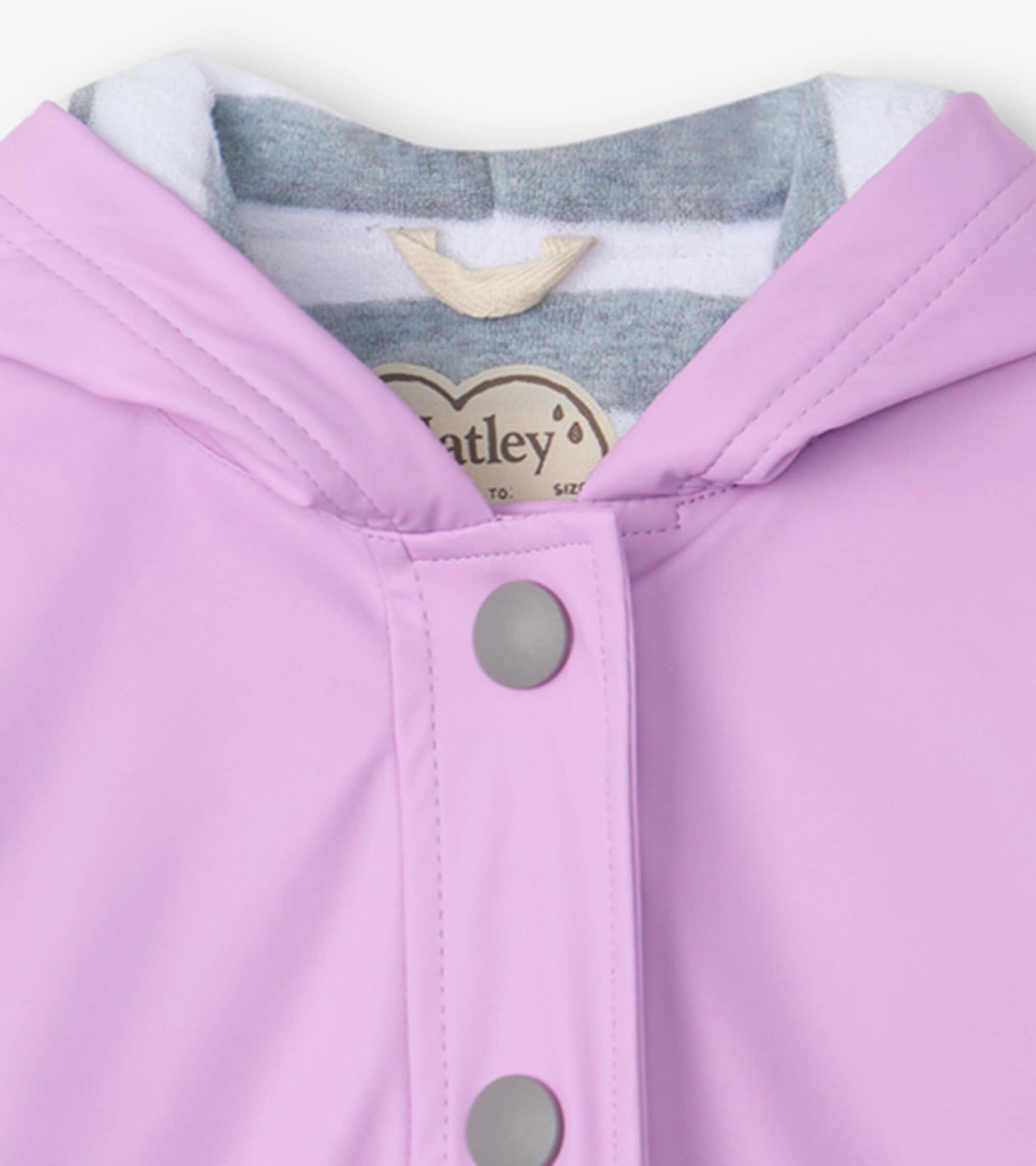 Lilac button-up rain jacket with a hood and gray lining, featuring snap closures along the front.