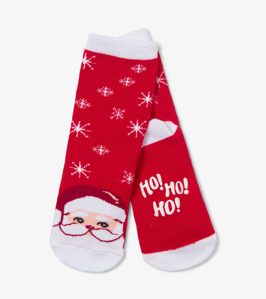Red socks featuring a Santa face, snowflake pattern, and "Ho! Ho! Ho!" text, with white cuffs and toe.