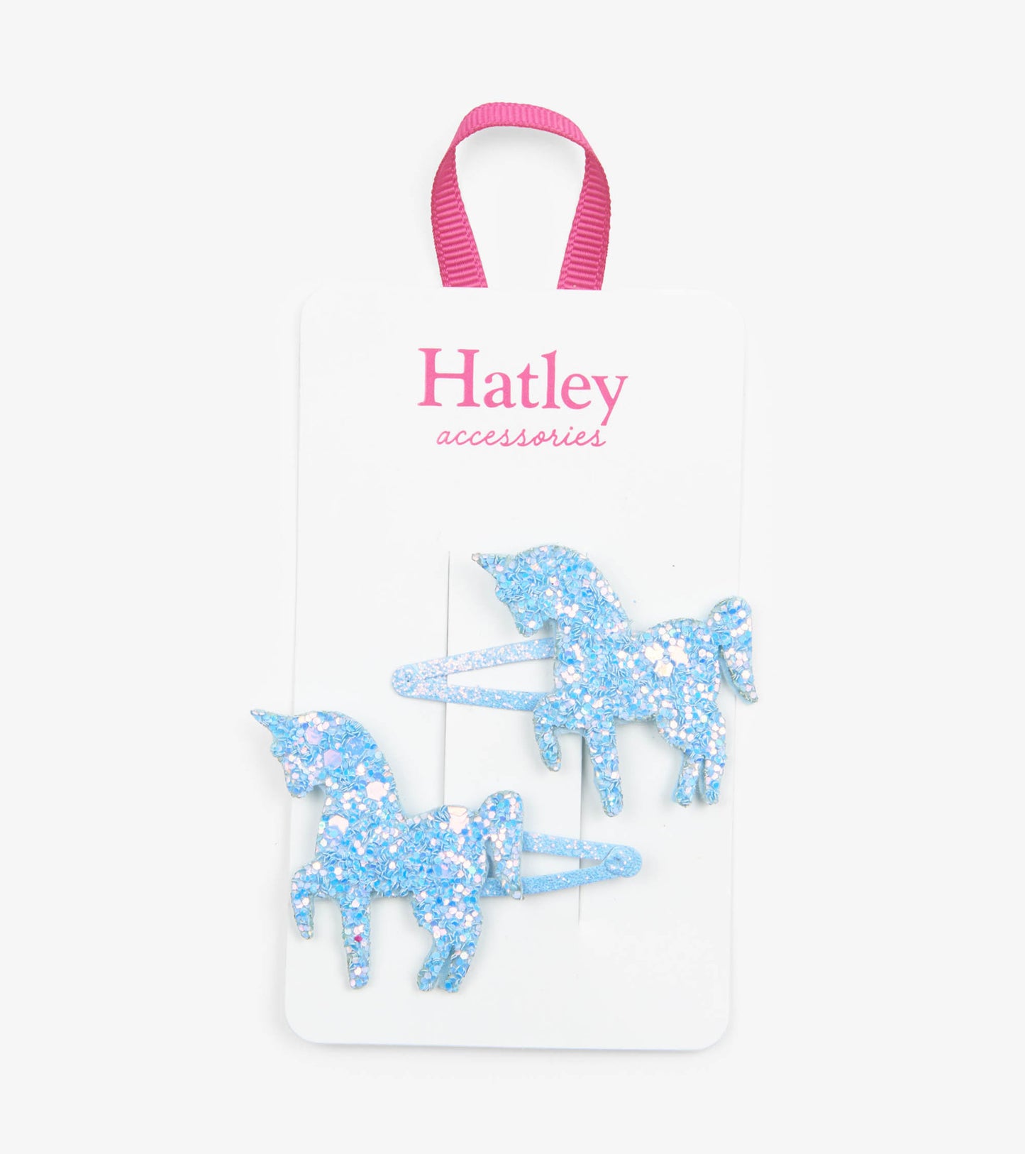 Blue glitter unicorn snap clips on a card with a pink ribbon, perfect for securing hair.