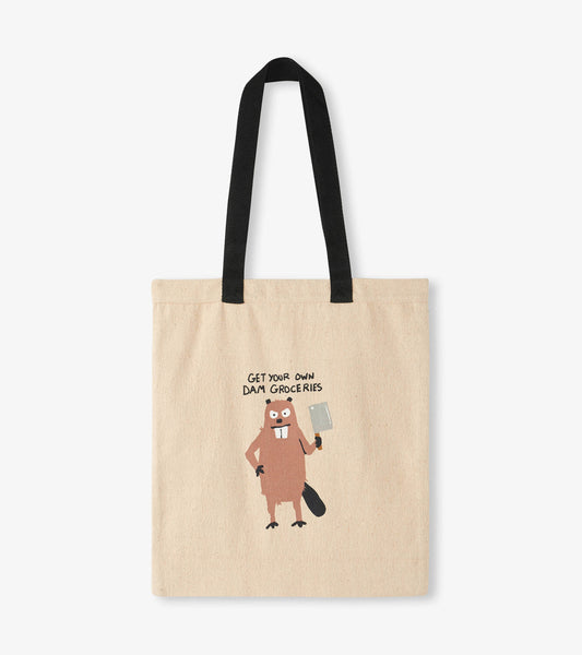 Beige reusable tote bag featuring a cartoon beaver holding a cleaver, with text above it. Black handles.