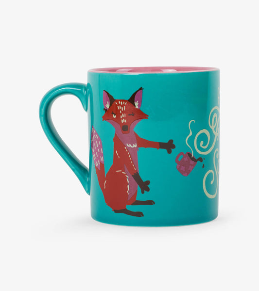 Teal ceramic mug featuring a whimsical fox design and pink interior, ideal for hot beverages.