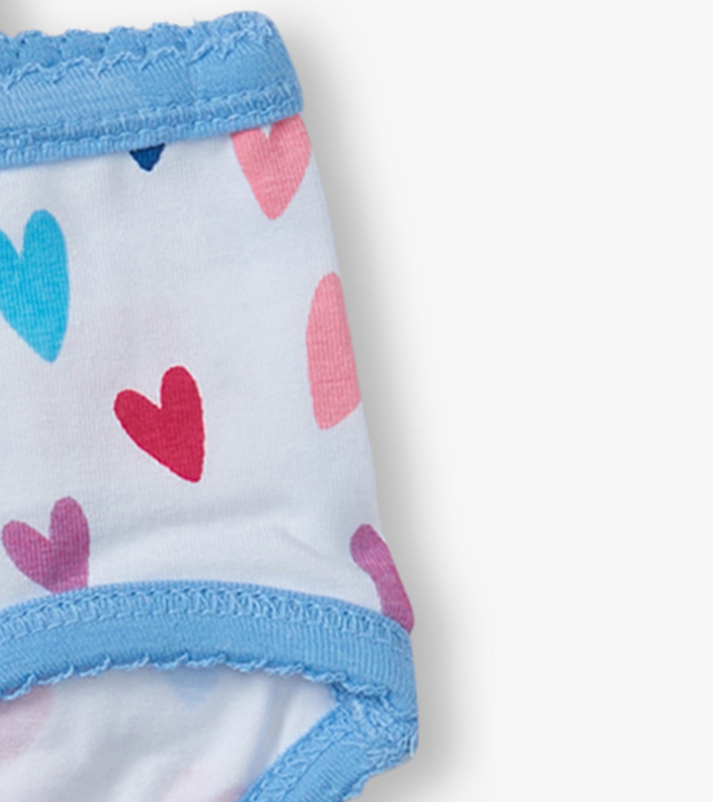 Girls' brief underwear featuring a white base with colorful heart patterns and a light blue elastic waistband.