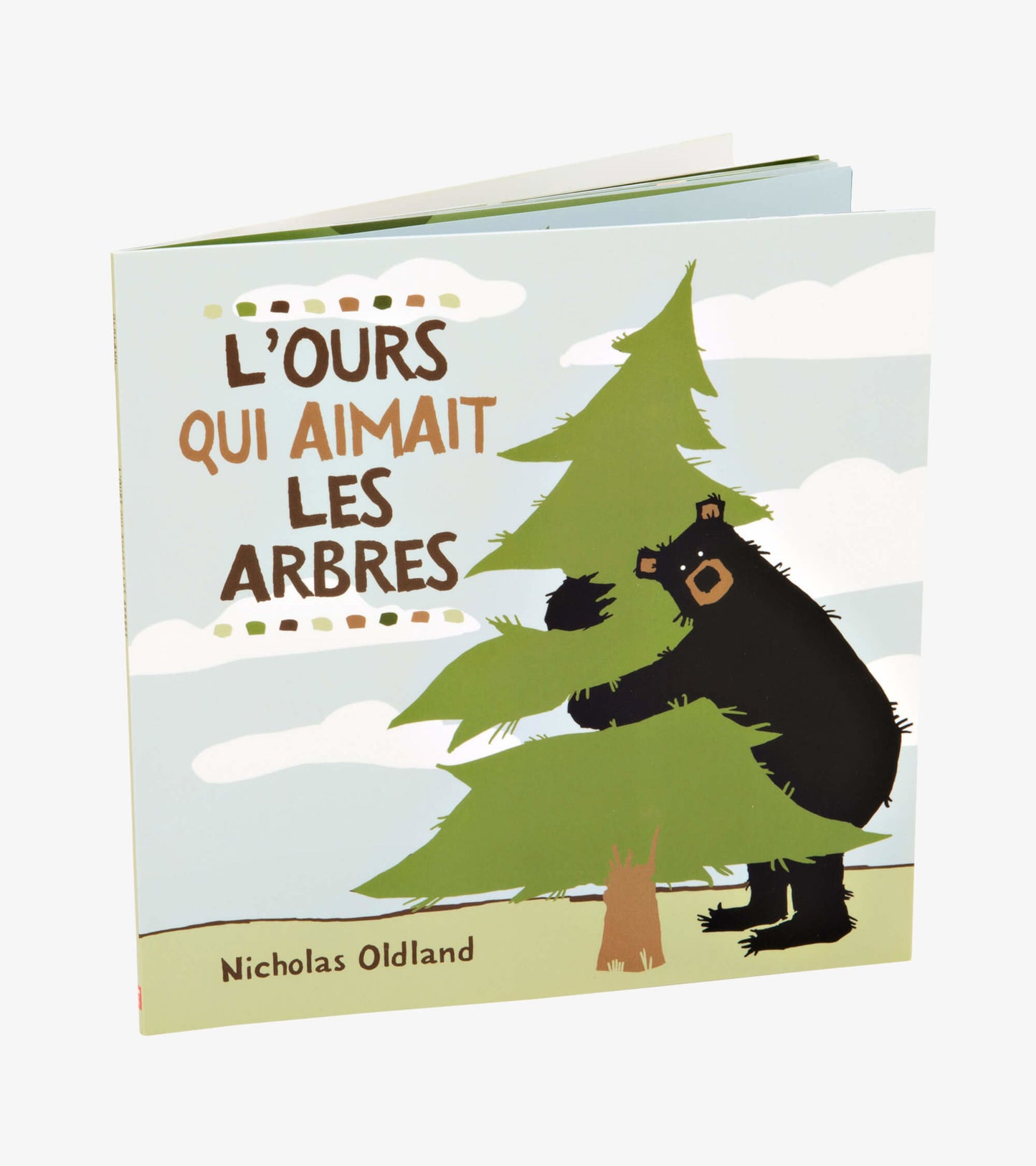 Children's book featuring a black bear hugging a green tree against a light blue sky with clouds.