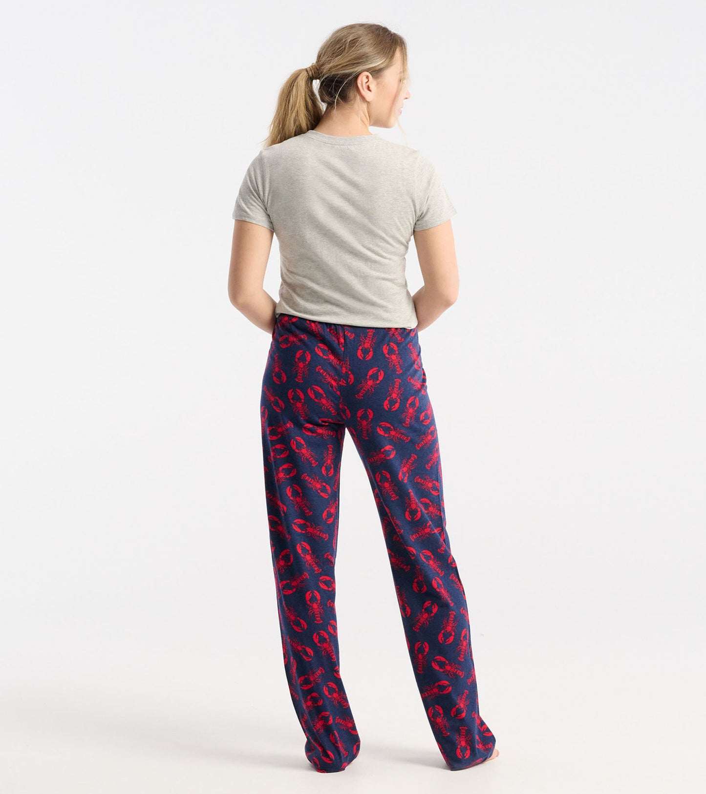 Navy cotton pajama pants featuring a lobster print, shown from the back on a model.