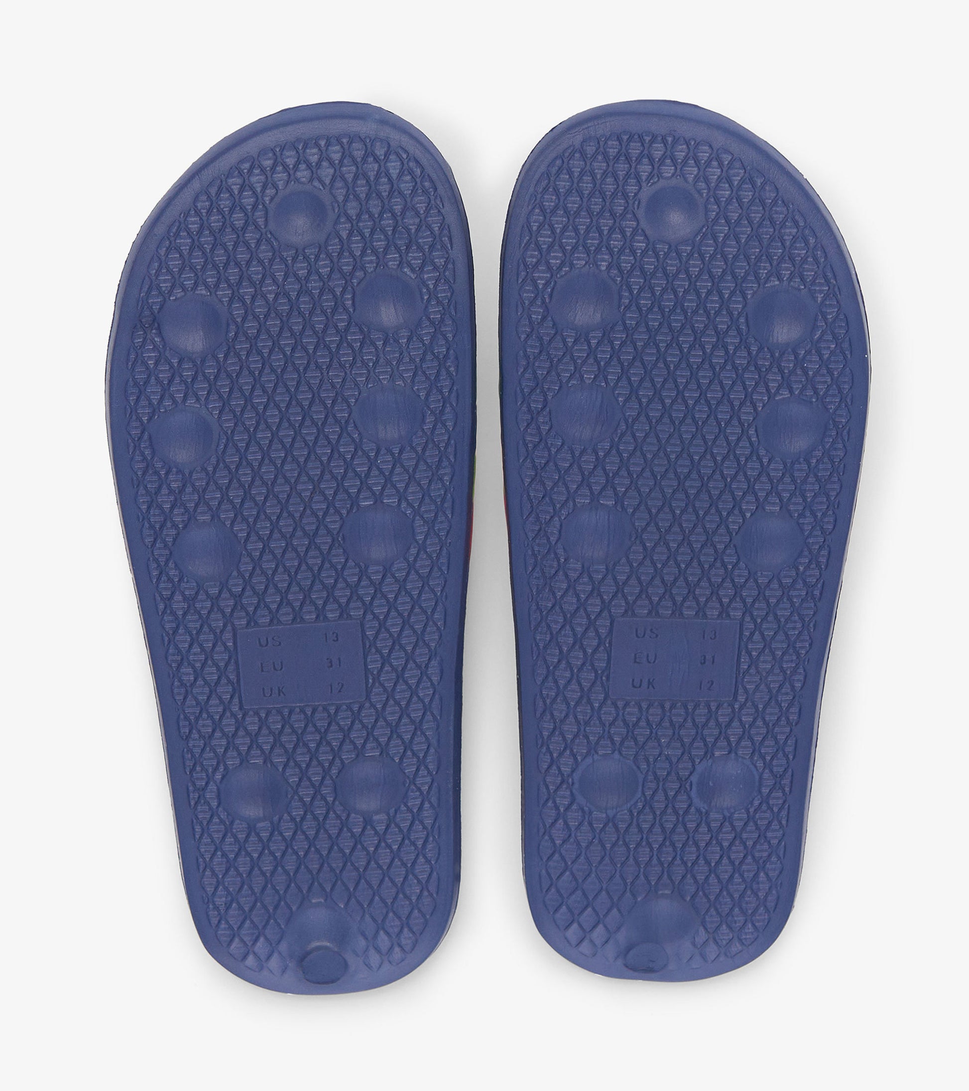 Purple rubber slide soles with textured grip and circular patterns, designed for comfort and stability.