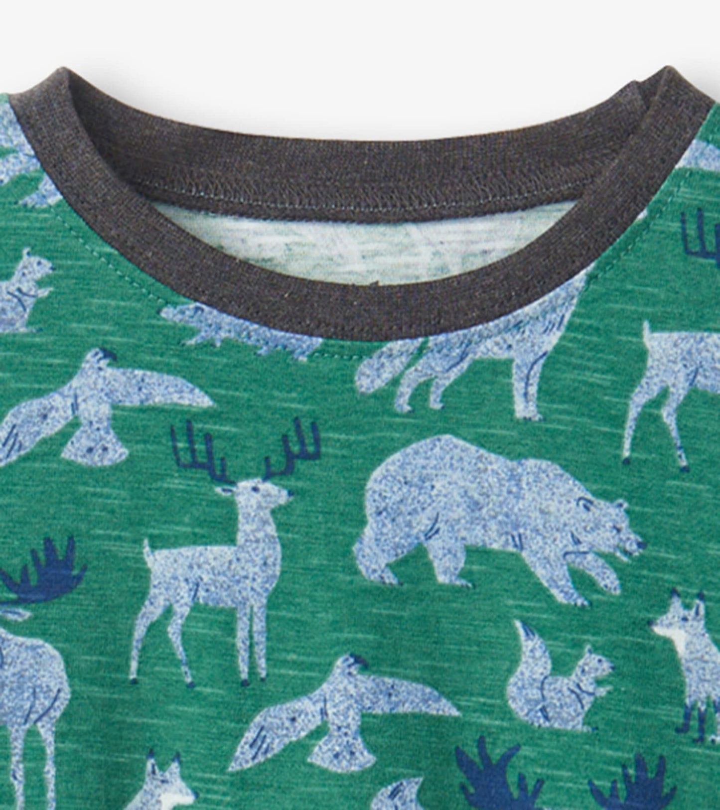 Green long sleeve t-shirt featuring a pattern of various forest animals in blue, with a dark gray neckline.