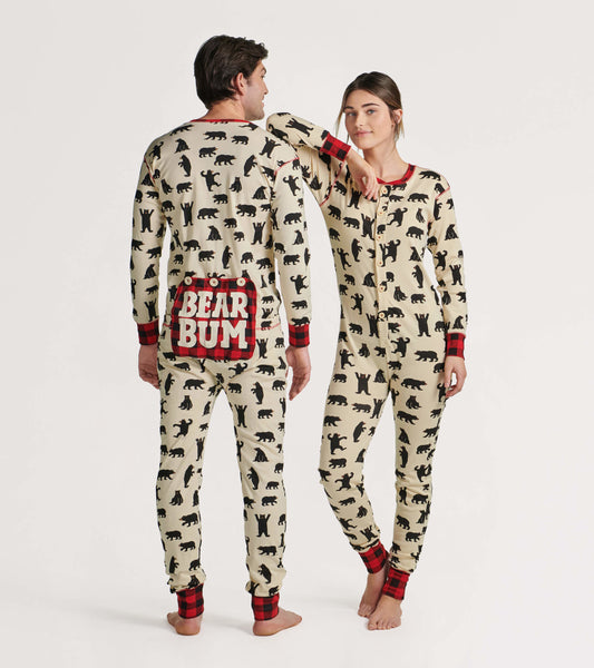Cream-colored adult onesie with black bear prints and red plaid accents, featuring a "BEAR BUM" design on the back.