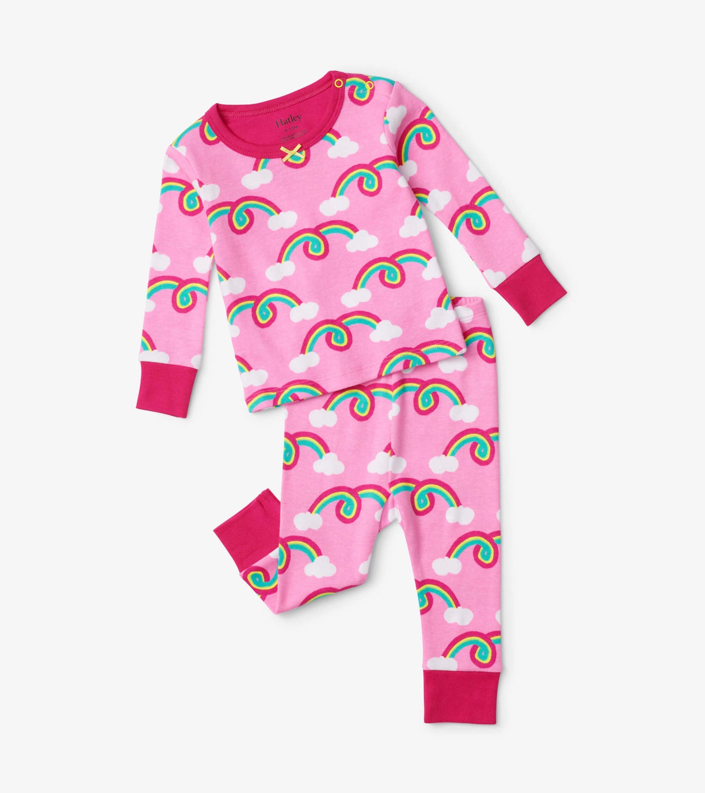 Pink baby pajama set featuring colorful rainbows and clouds, with long sleeves and matching pants.