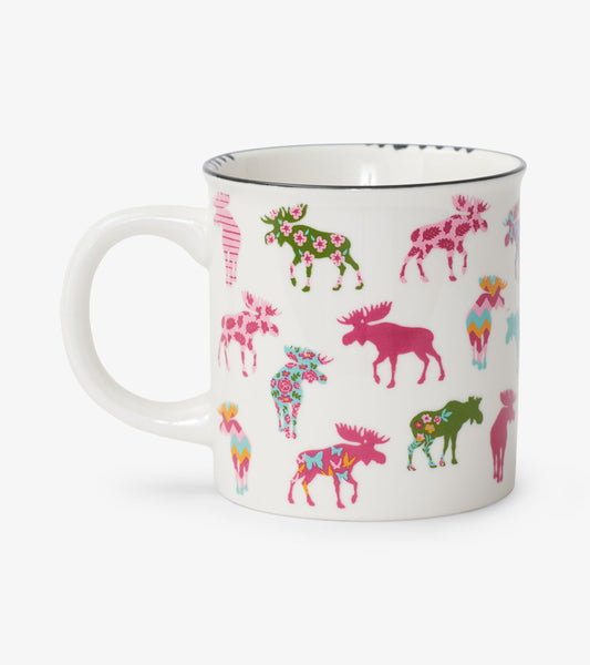 White ceramic camping mug featuring colorful patterned moose in various designs and colors.