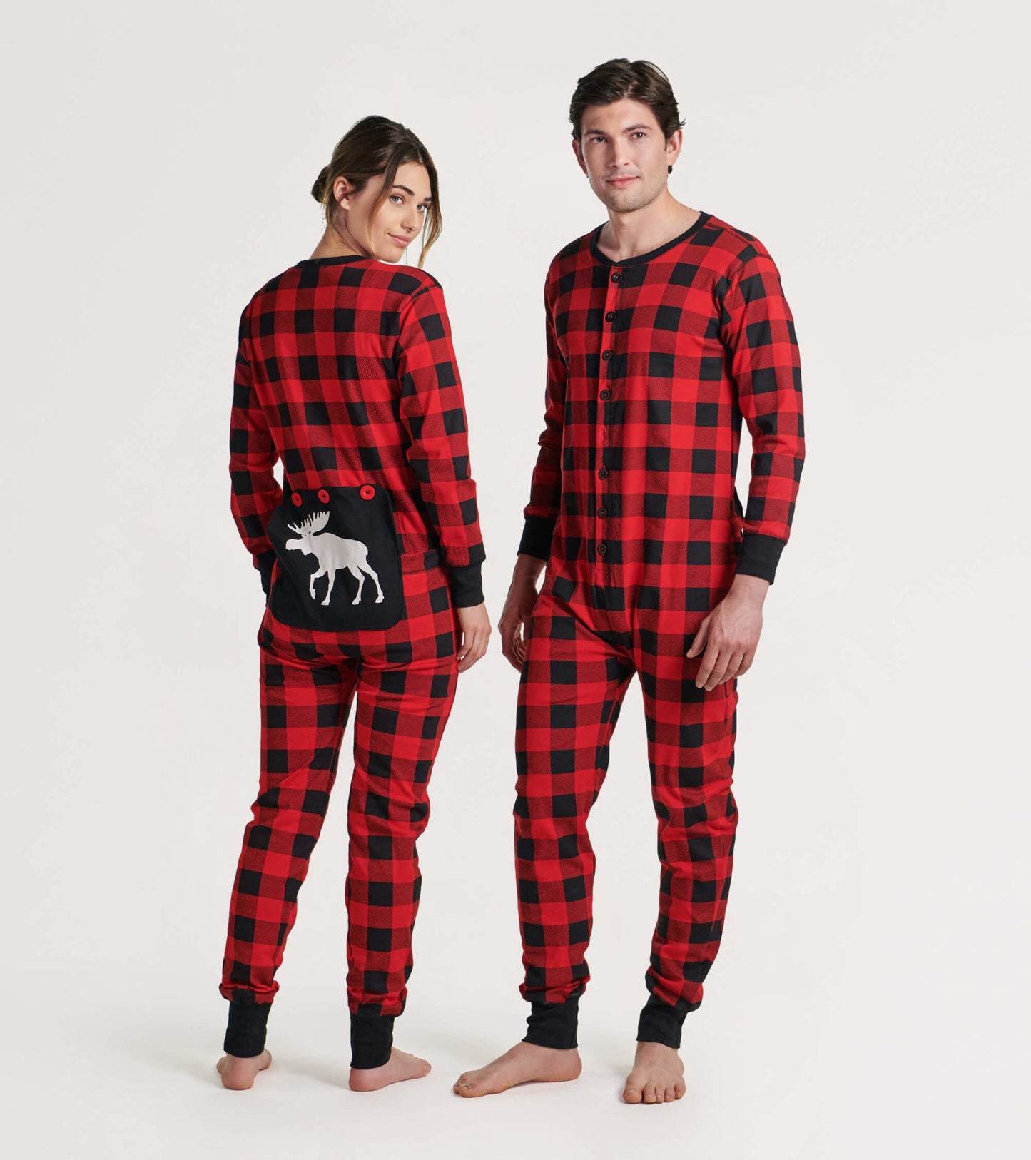 Red and black plaid adult onesie featuring a moose design on the back, with button closure and long sleeves.