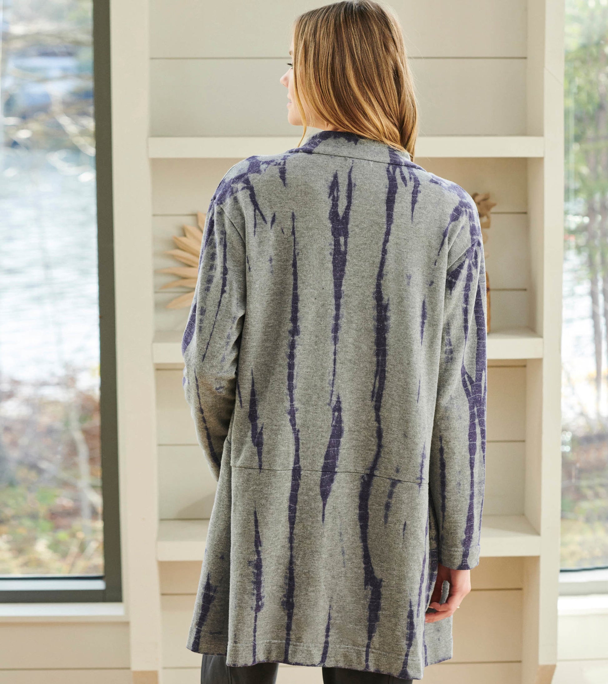 Long gray cardigan with purple tie-dye stripes, shown from the back, featuring a relaxed fit and long sleeves.