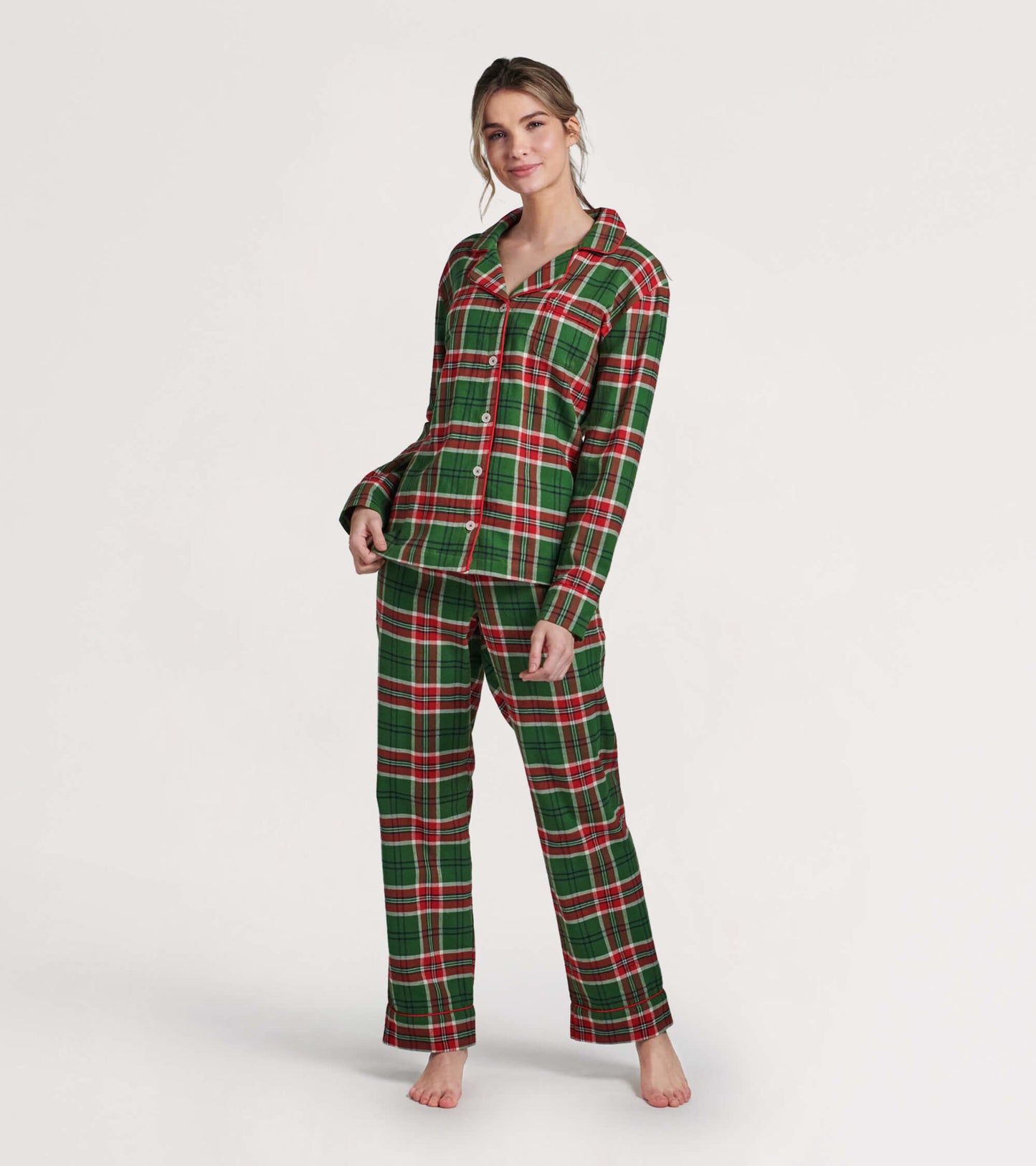 Green and red plaid flannel pajama set featuring a button-up top and matching pants, perfect for cozy winter nights.