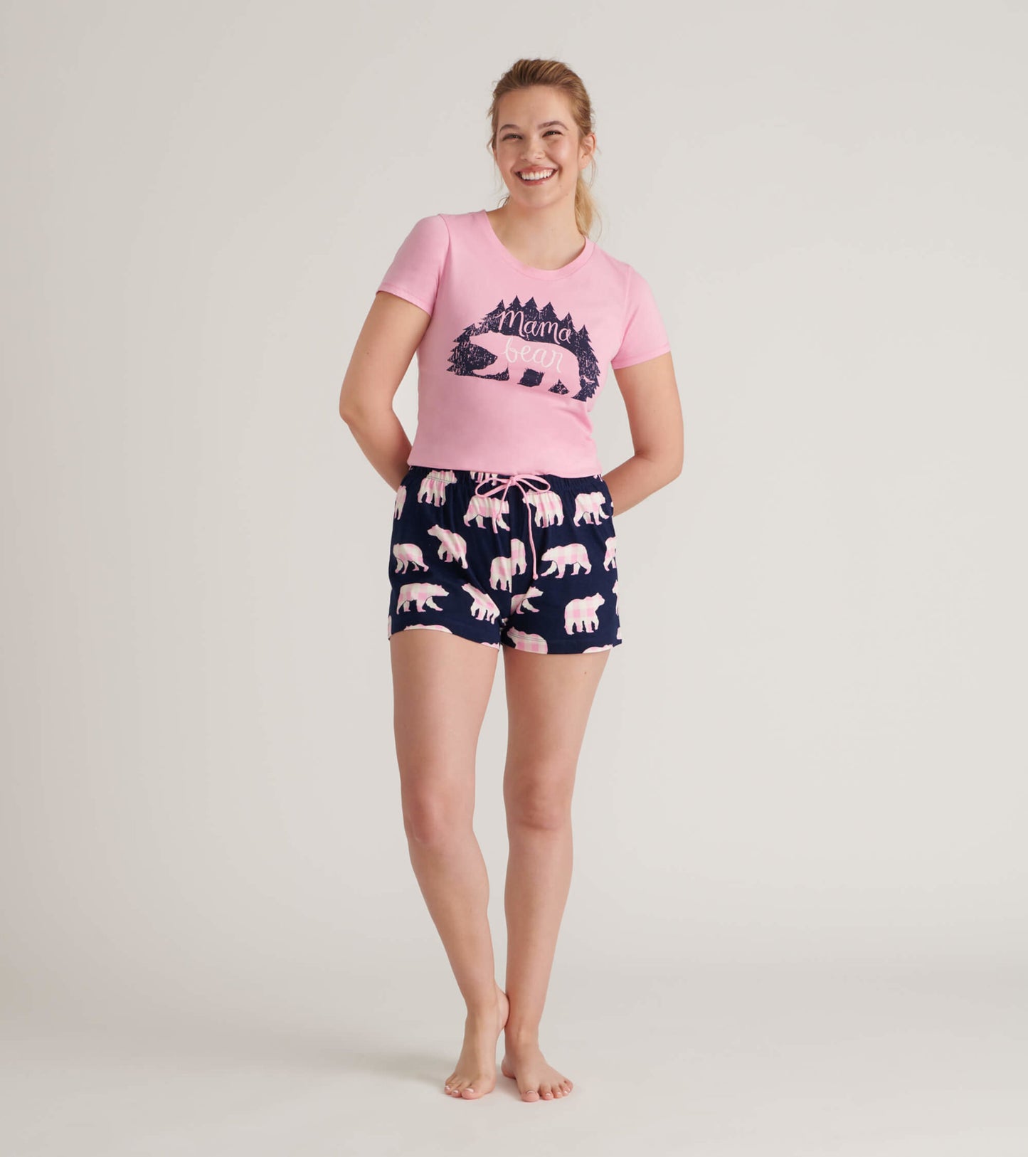 Cotton sleep shorts in navy with pink bear print, featuring an elastic waistband and drawstring.