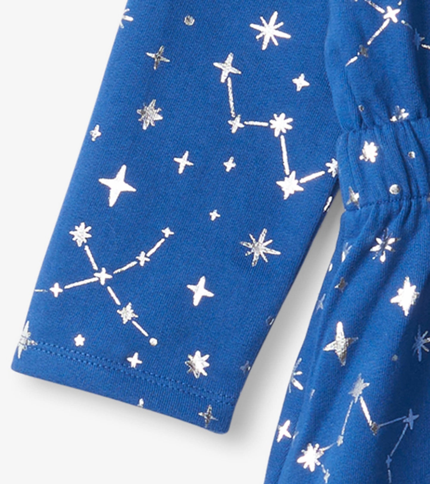 Blue terry dress featuring silver constellation patterns and an elastic waist, suitable for casual wear.