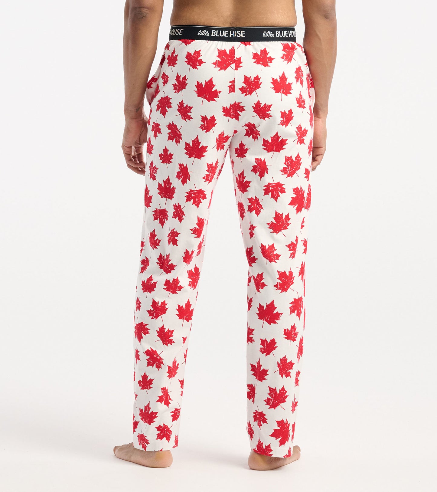 Men's cotton pajama pants featuring a white background with red maple leaf pattern and an elastic waistband.