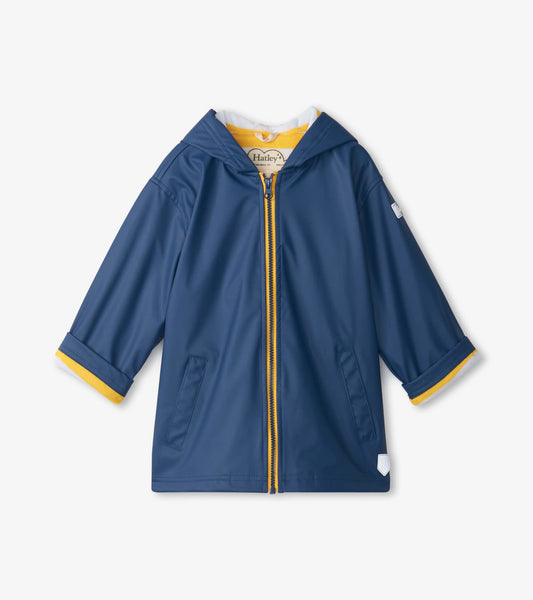 Navy zip-up rain jacket for kids with a hood and yellow trim, featuring two front pockets and short sleeves.