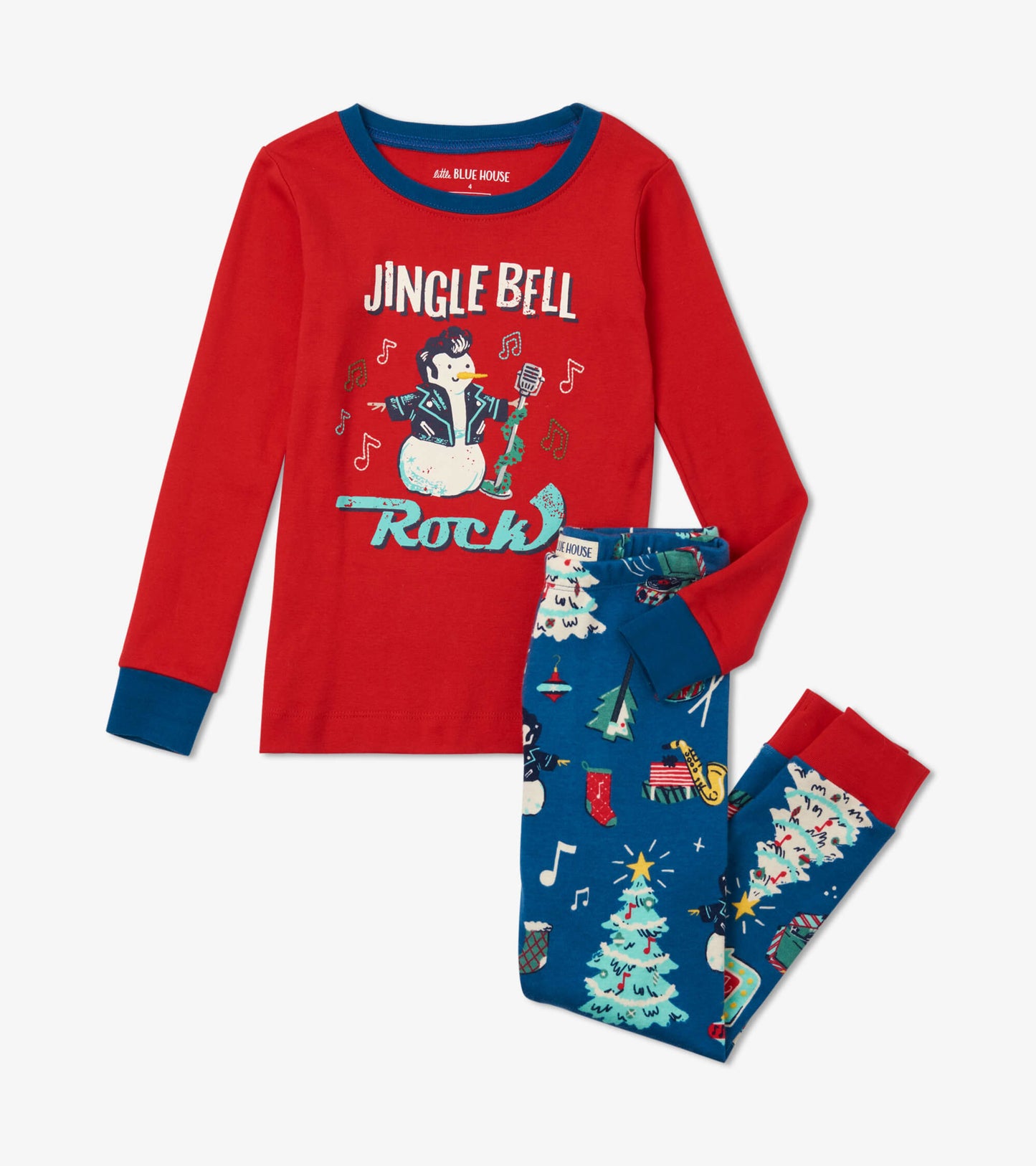Red long-sleeve pajama top with festive graphic, paired with blue pajama pants featuring Christmas tree and musical notes pa…
