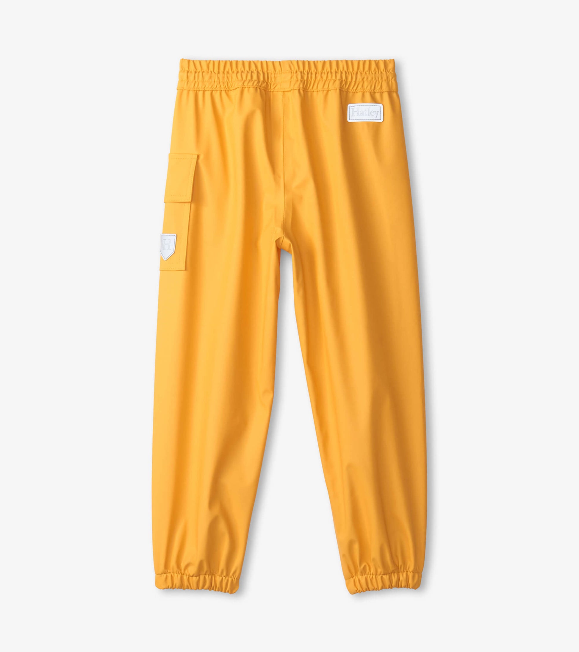 Bright yellow kids' rain pants with elastic waistband and side pocket, designed for outdoor play in wet weather.