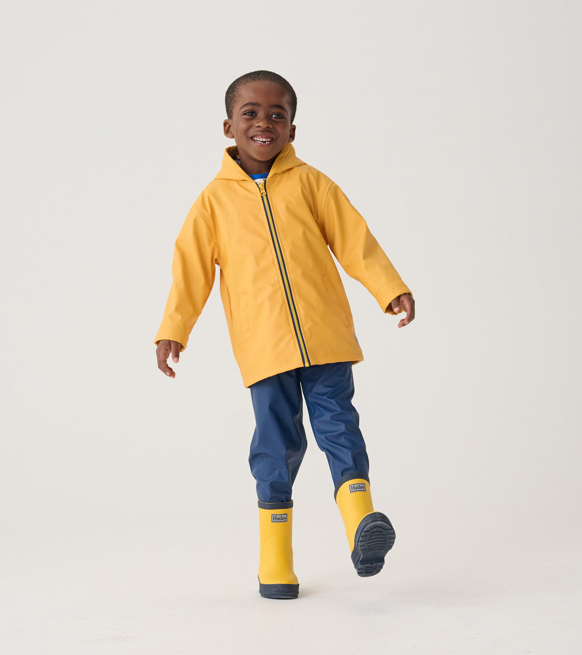 Yellow and navy matte rain boots for kids, featuring a sturdy design suitable for wet weather.