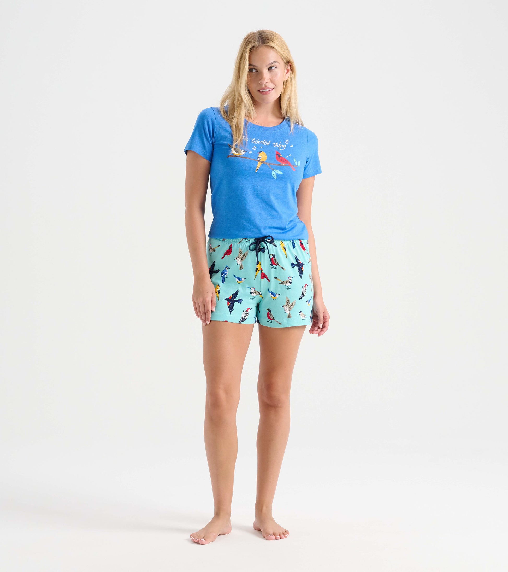 Light blue cotton sleep shorts featuring a colorful bird print, with an elastic waistband and drawstring.