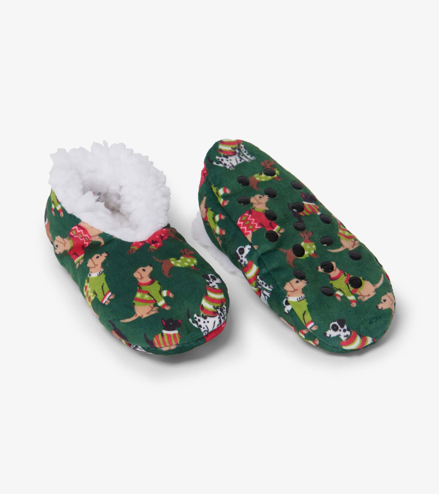 Green slippers featuring a cozy white lining and playful dog patterns, perfect for keeping little feet warm.