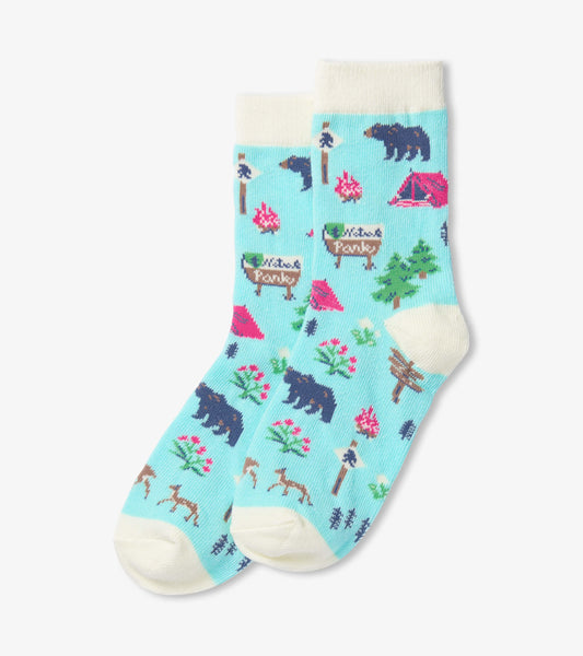 Teal crew socks featuring a playful camping pattern with bears, trees, and tents, ideal for kids aged 2-7.